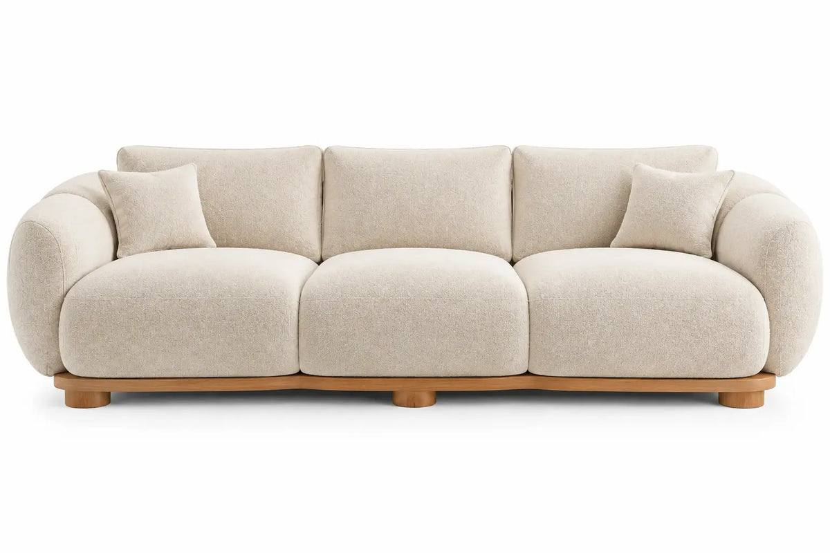 Canapé droit beige à trois coussins d'assise et accoudoirs arrondis