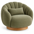 Fauteuil vert arrondi à dossier cannelé et base circulaire